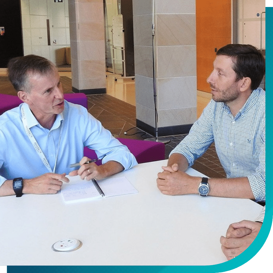 Two people sitting at a desk collaborating